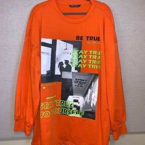 Orange "stay true" shirt